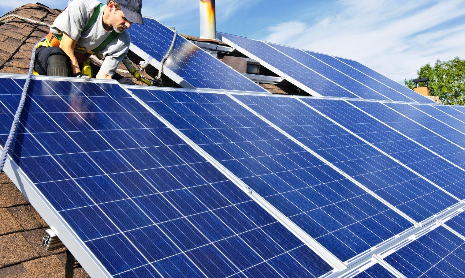 An installation crew at work on a residential rooftop
